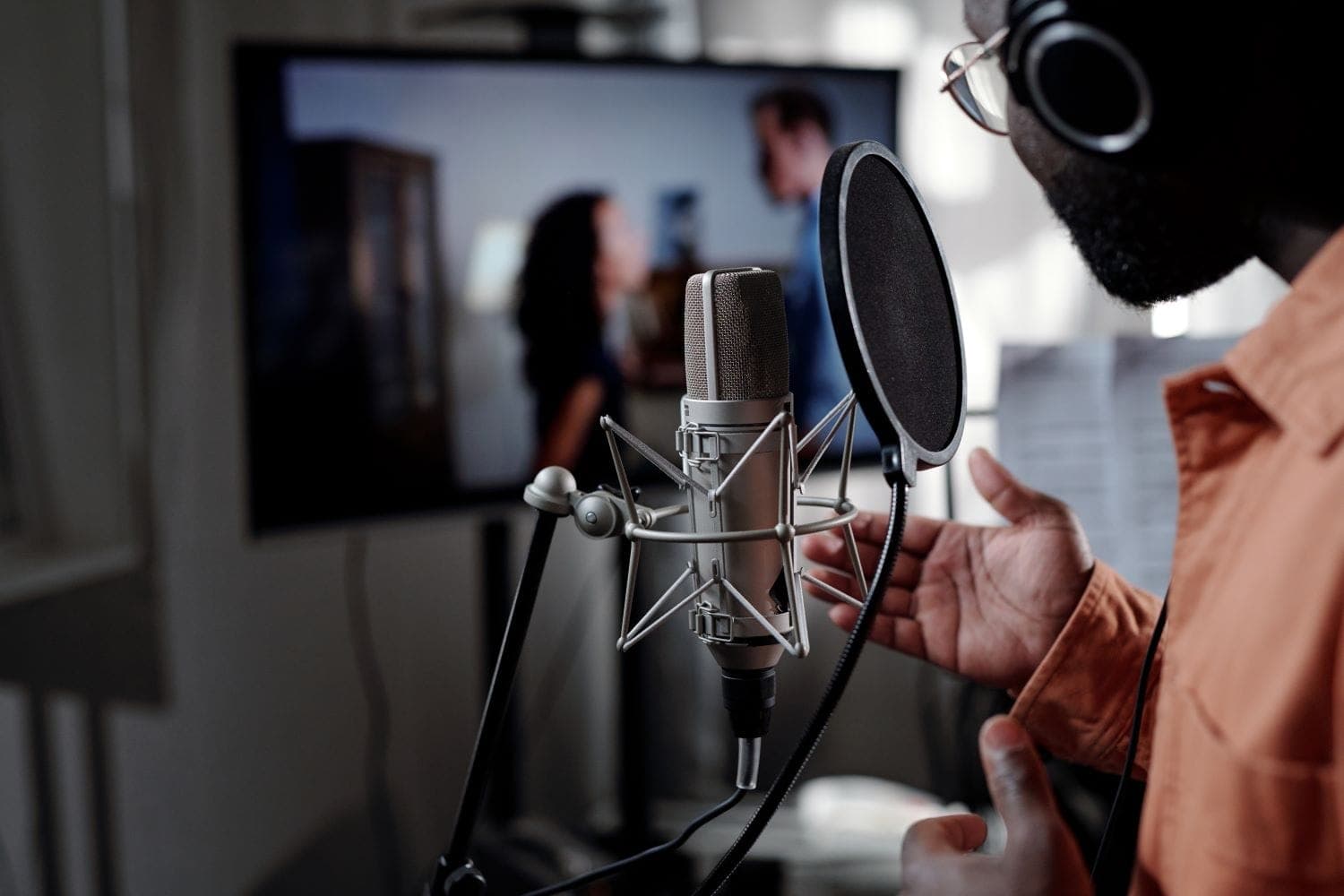 Voice actor recording in a broadcast-quality studio