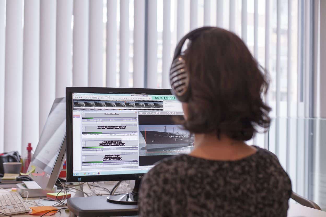 Subtitler timing Urdu subtitles against video in GoLocalise's London studio