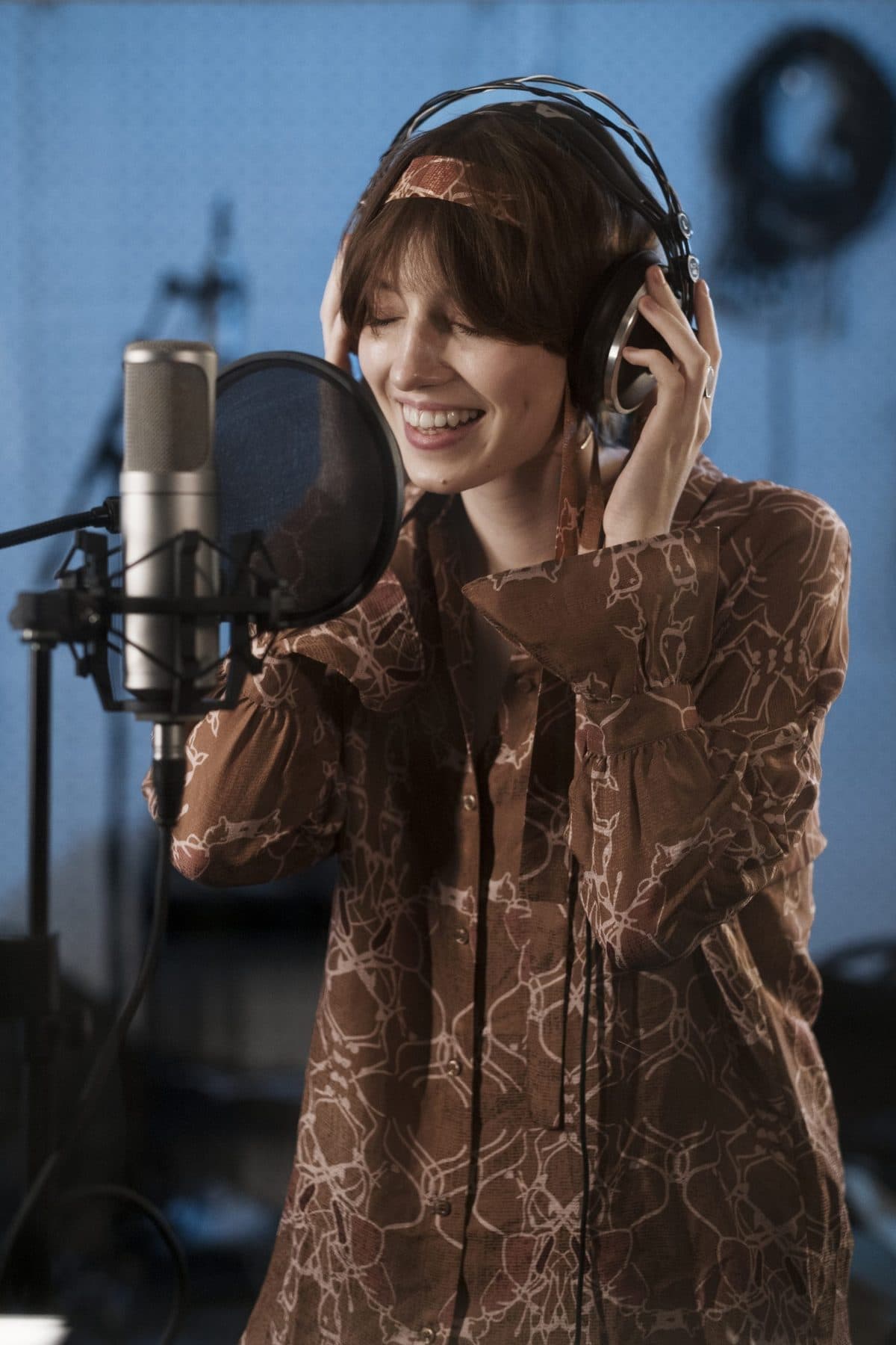 Female voice over artist recording in studio