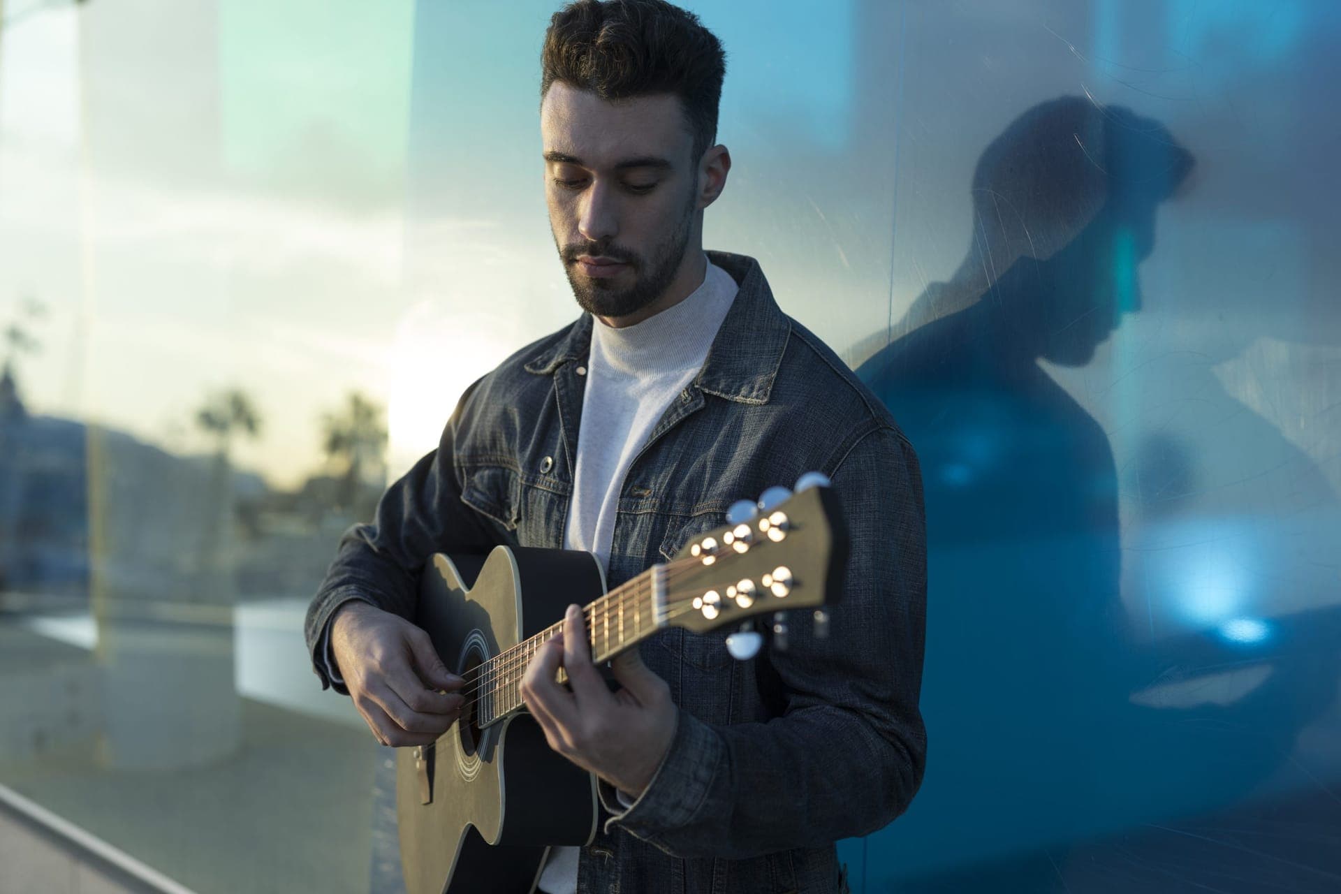 Musician playing guitar outdoors