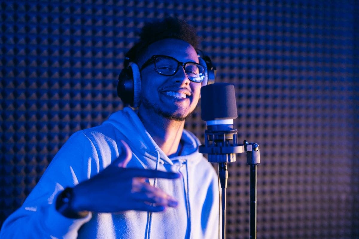 Male voice actor singing in studio
