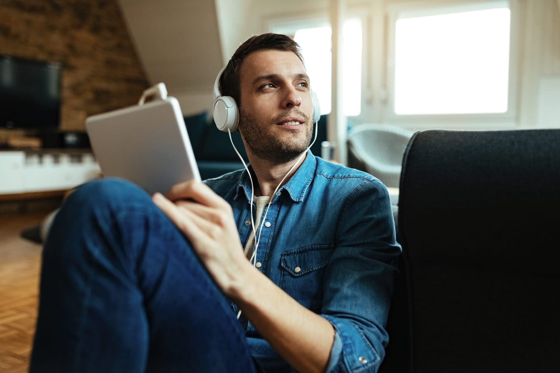 Man relaxing while listening with headphones