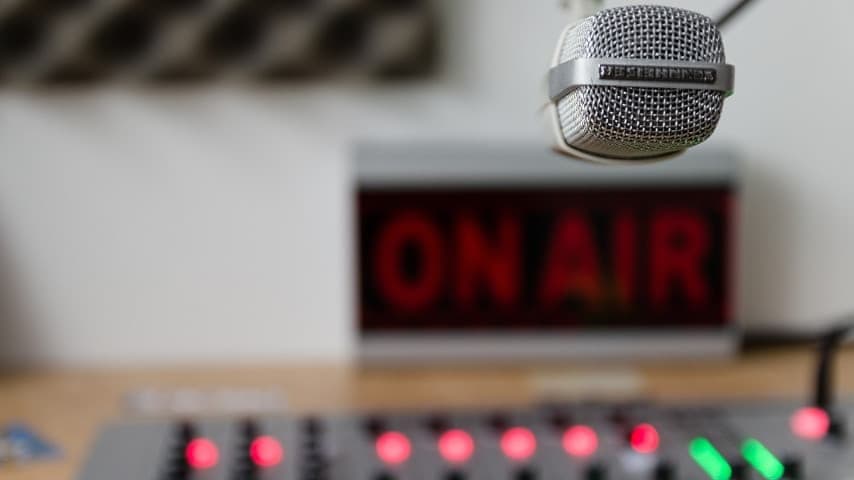 Recording studio microphone, console and on-air sign