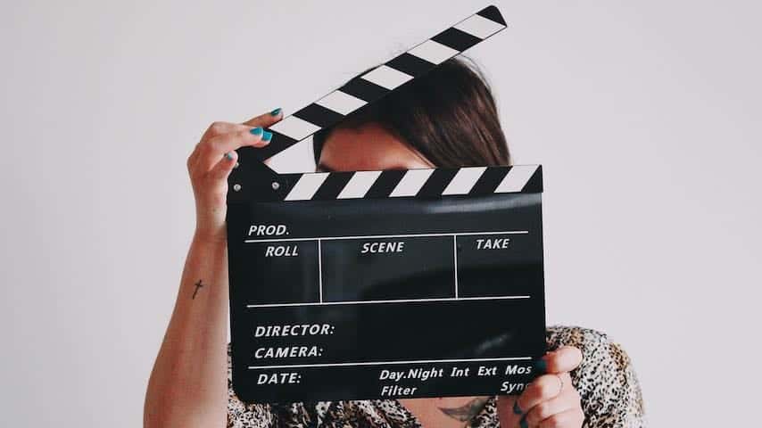 Image of a director to illustrate an article on the role of a voice over director. Photo by Jon Tyson on Unsplash