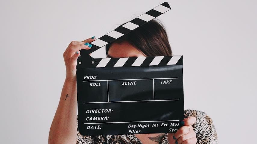 Image of a director to illustrate an article on the role of a voice over director. Photo by Jon Tyson on Unsplash