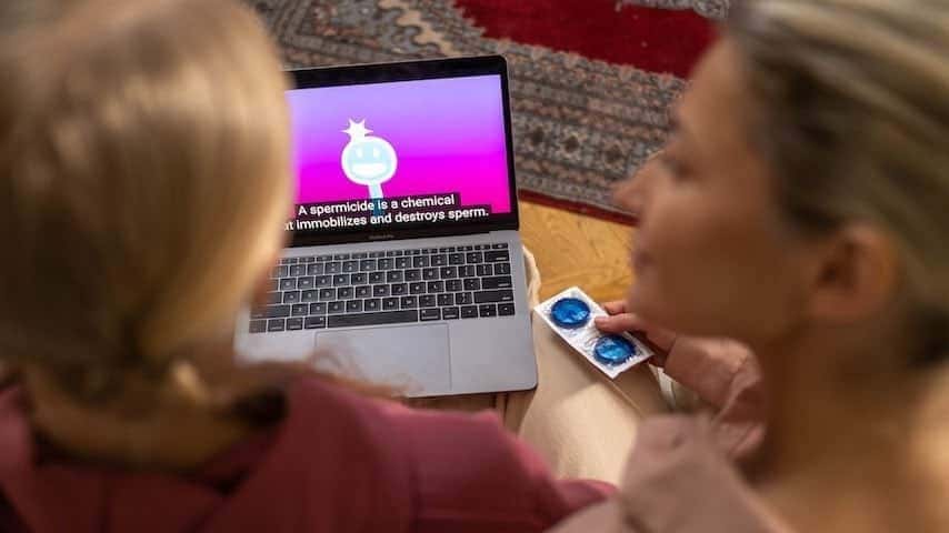 Open Captions. Picture of a laptop playing a video presentation with captions on screen to illustrate the article Open Captions vs. Closed Captions: What's the Difference?