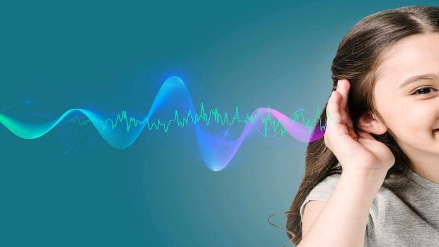 A young girl listening to a voice over