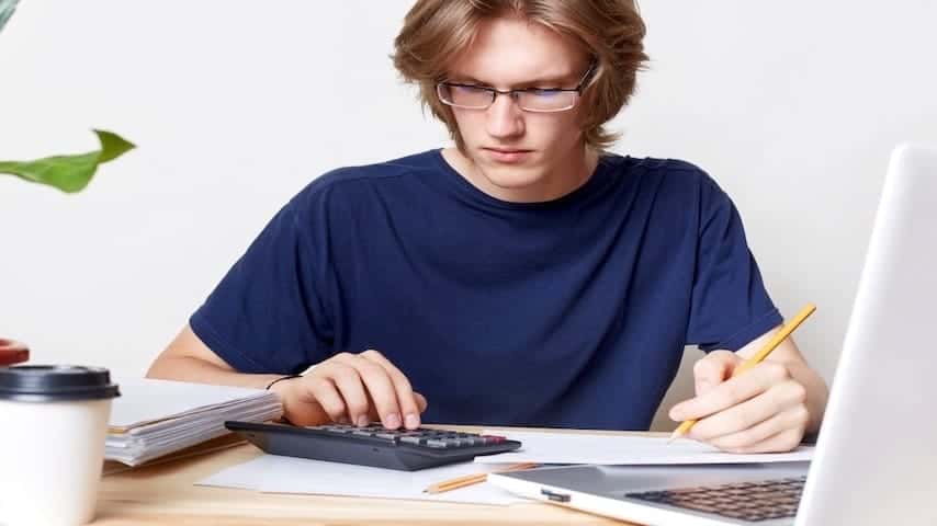 A man calculating voice over fees for a TV commercial