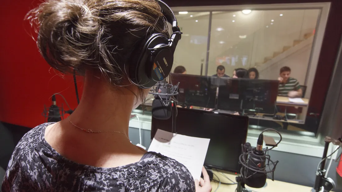 Red Studio voice artists viewed from the control room during a session