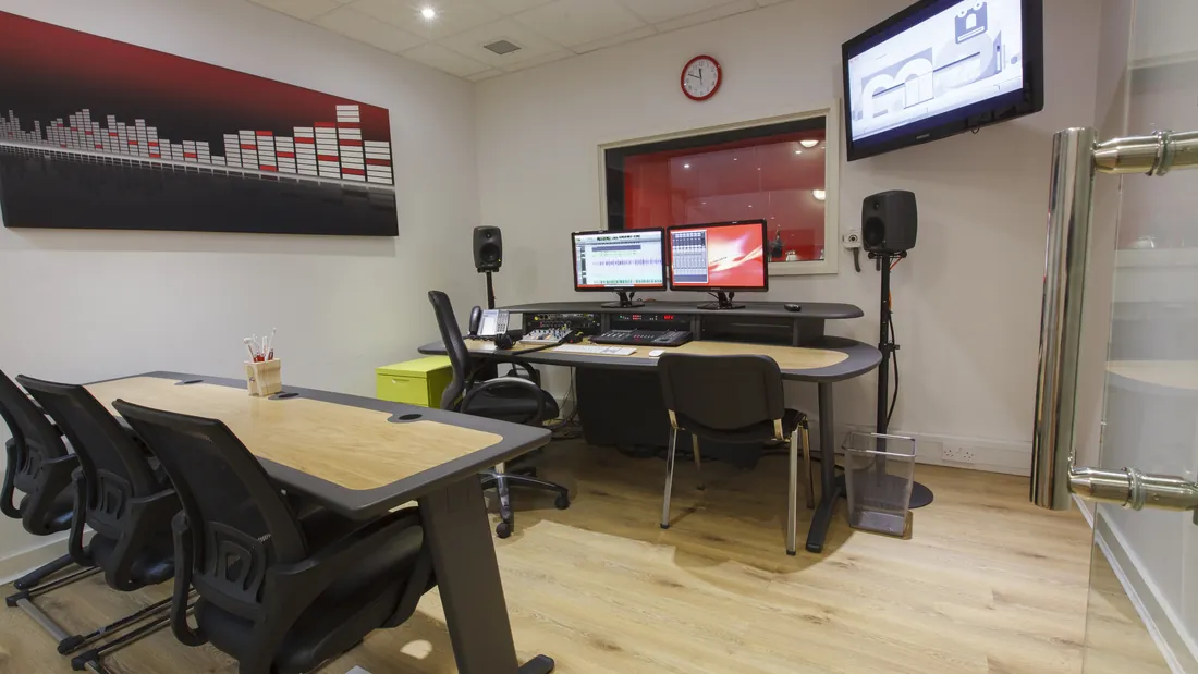 Red Studio control room with seating for attending clients