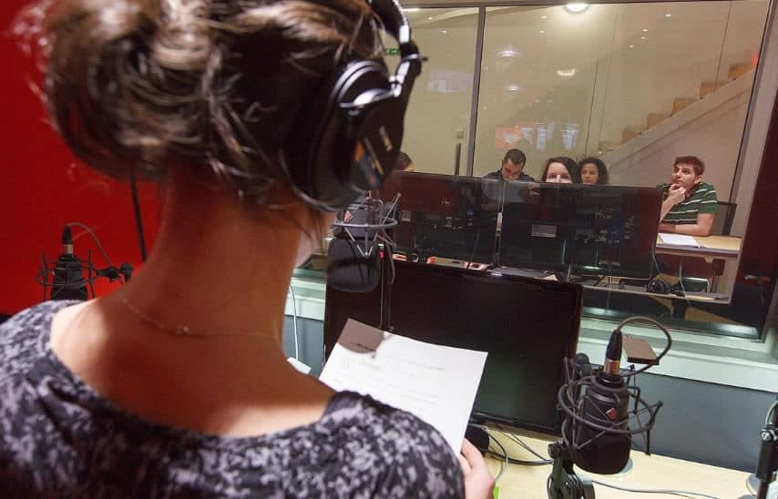 Voice over artist working at GoLocalise's red studio