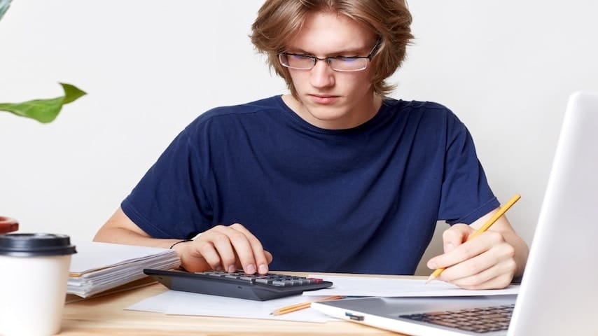 A man calculating voice over fees for a TV commercial