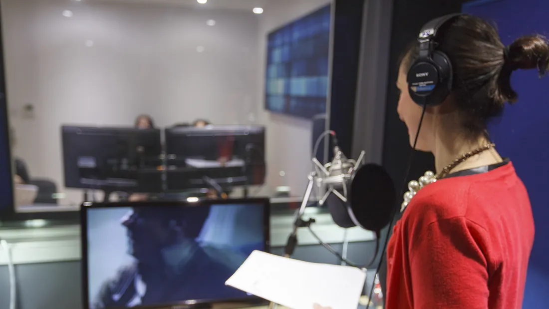 Voice artist recording in the Blue Studio booth
