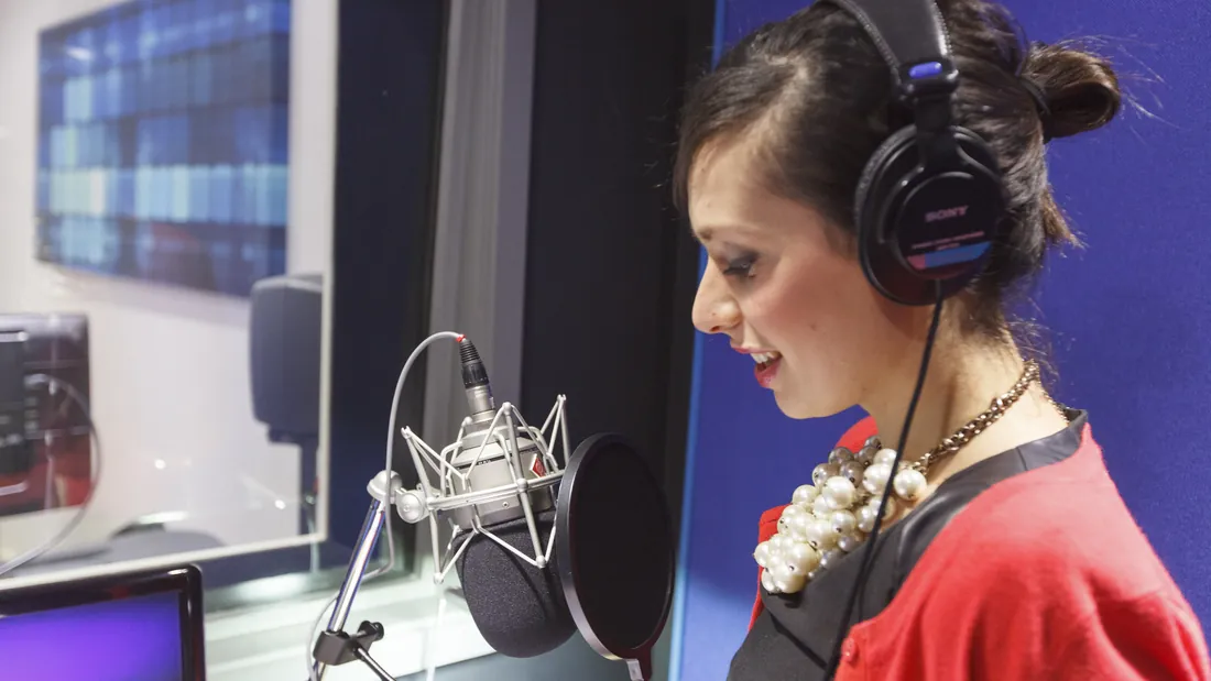 Voice artist recording at the microphone in the GoLocalise London studio